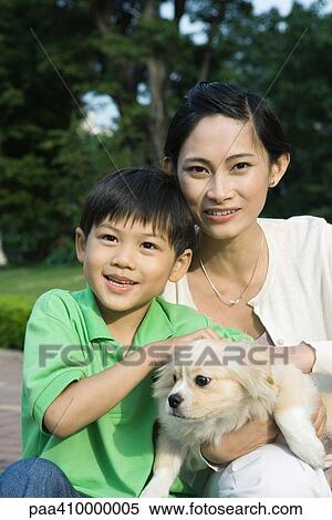 Mother and son with dog, portrait View Large Photo Image Stock Photography - Mother and son with dog, portrait. Fotosearch