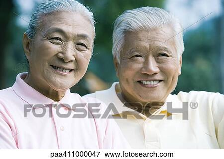 Stock Photo - Senior couple, smiling at camera, portrait. Fotosearch