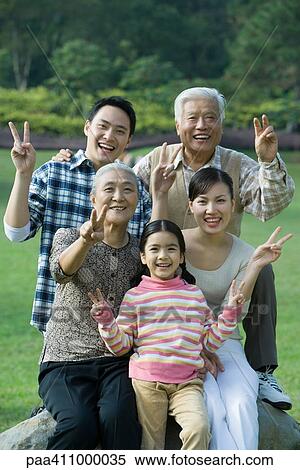 Stock Photography - Three generation family in park, portrait. Fotosearch