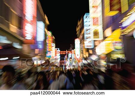 Picture - China, Guangzhou, crowded pedestrian street at night. Fotosearch