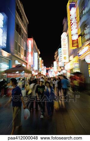 China, Guangzhou, crowded pedestrian street at night View Large Photo Image Stock Photo - China, Guangzhou, crowded pedestrian street at night. Fotosearch
