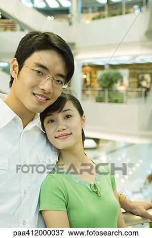 Couple in mall, portrait View Large Photo Image Stock Photo - Couple in mall, portrait. Fotosearch