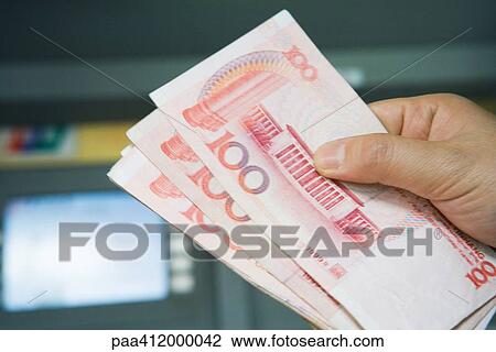 Hand holding 100 Yuan bills View Large Photo Image Stock Image - Hand holding 100 Yuan bills. Fotosearch