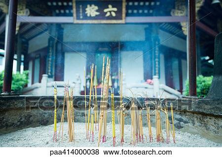 Incense burning in front of temple View Large Photo Image Stock Photo - Incense burning in front of temple. Fotosearch