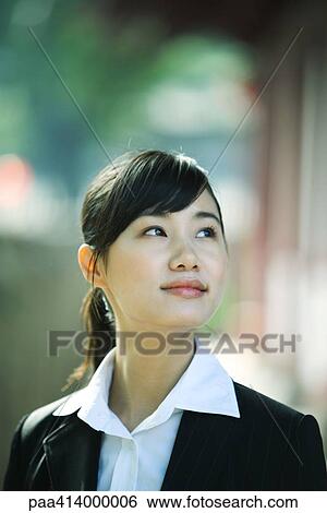 Woman looking up, portrait View Large Photo Image Stock Photograph - Woman looking up, portrait. Fotosearch