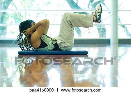 Man doing sit-ups, full length View Large Photo Image Stock Image - Man doing sit-ups, full length. Fotosearch