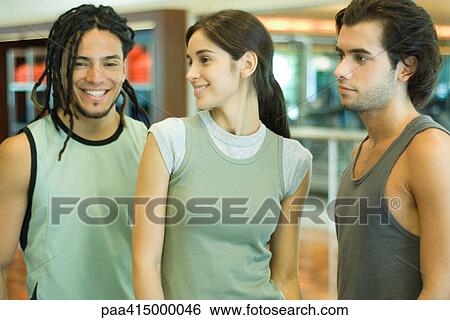 Three young adults wearing workout clothes, waist up, portrait View Large Photo Image Stock Photograph - Three young adults wearing workout clothes, waist up, portrait. Fotosearch