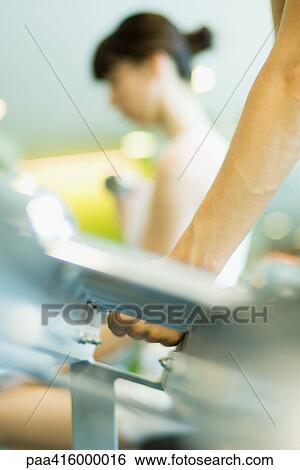 Woman picking up dumbbell, close-up of arm View Large Photo Image Stock Photograph - Woman picking up dumbbell, close-up of arm. Fotosearch