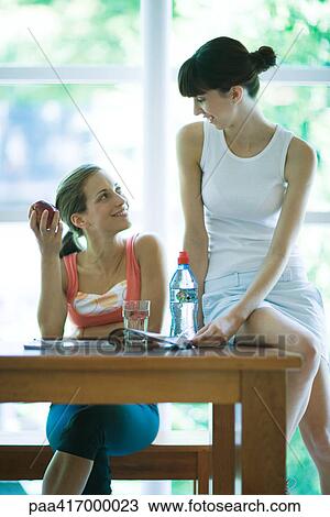 Young women having healthy snack View Large Photo Image Stock Image - Young women having healthy snack . Fotosearch
