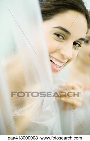 Woman looking at camera from behind shower View Large Photo Image Stock Photo - Woman looking at camera from behind shower . Fotosearch