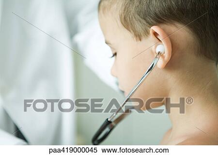 Boy listening to stethoscope View Large Photo Image Stock Photography - Boy listening to stethoscope. Fotosearch