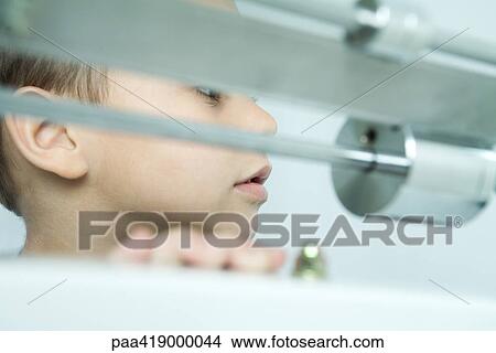 Boy, scale in foreground, close-up View Large Photo Image Picture - Boy, scale in foreground, close-up. Fotosearch