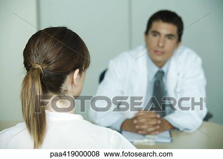 Doctor listening to patient View Large Photo Image Stock Photo - Doctor listening to patient. Fotosearch