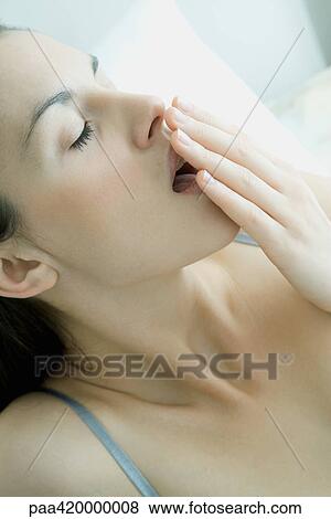 Woman yawning View Large Photo Image Stock Photo - Woman yawning. Fotosearch
