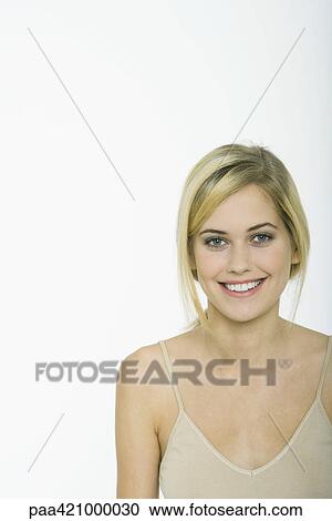 Teenage girl smiling at camera, portrait View Large Photo Image Stock Image - Teenage girl smiling at camera, portrait. Fotosearch