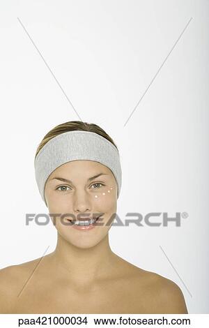 Young woman with dots of moisturizer under eye View Large Photo Image Picture - Young woman with dots of moisturizer under eye. Fotosearch