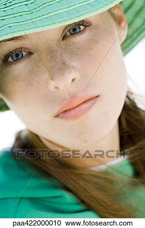 Woman wearing sunhat, close-up, portrait View Large Photo Image Stock Image - Woman wearing sunhat, close-up, portrait. Fotosearch