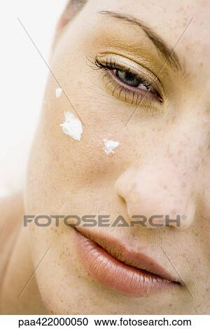 Woman's face with dots of moisturizer under eye, cropped view View Large Photo Image Stock Image - Woman's face with dots of moisturizer under eye, cropped view. Fotosearch