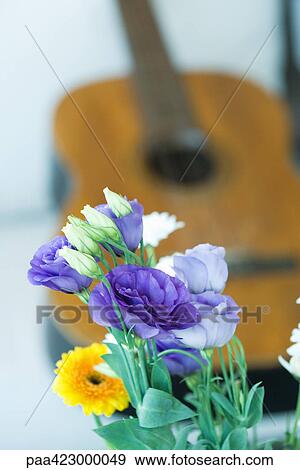 Flowers and guitar View Large Photo Image Stock Photo - Flowers and guitar. Fotosearch