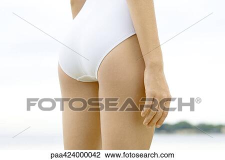 Teenage girl wearing bathing suit, rear view, mid section View Large Photo Image Stock Image - Teenage girl wearing bathing suit, rear view, mid section. Fotosearch
