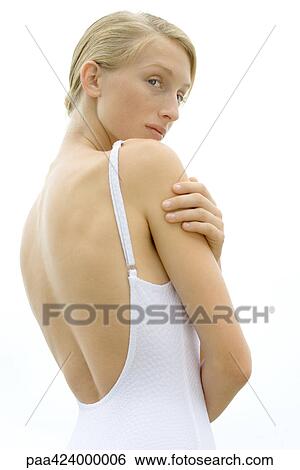 Teenage girl wearing bathing suit, looking away, low angle view View Large Photo Image Stock Photograph - Teenage girl wearing bathing suit, looking away, low angle view. Fotosearch