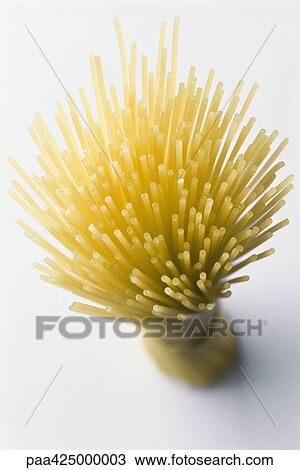 Stock Image - Bundle of spaghetti, high angle view. Fotosearch