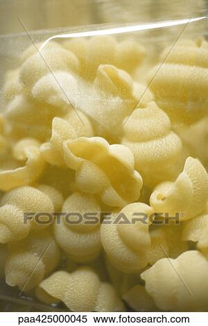 Gnocchi pasta in package, close-up View Large Photo Image Stock Photography - Gnocchi pasta in package, close-up. Fotosearch
