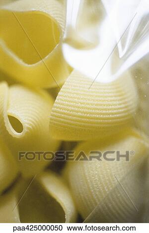 Lumaconi pasta in package, close-up View Large Photo Image Stock Image - Lumaconi pasta in package, close-up. Fotosearch
