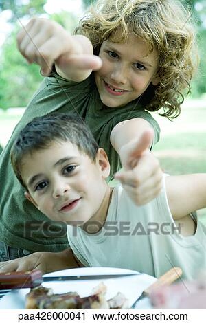 Boys standing next to plate of meat, making thumbs up gesture at camera View Large Photo Image Stock Image - Boys standing next to plate of meat, making thumbs up gesture at camera. Fotosearch