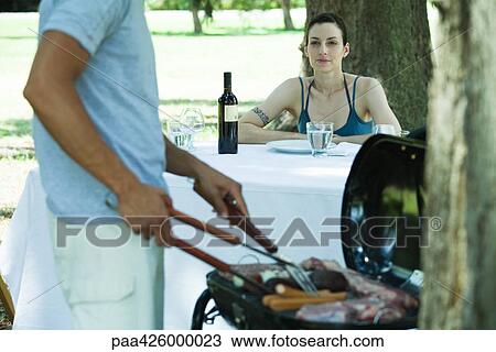 Couple having cookout View Large Photo Image Stock Image - Couple having cookout. Fotosearch