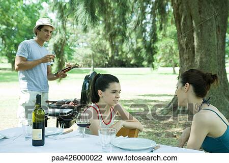 Family having cookout View Large Photo Image Stock Image - Family having cookout. Fotosearch
