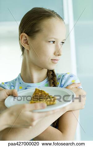 Hands holding up slice of quiche for girl, girl crossing arms and looking away View Large Photo Image Stock Image - Hands holding up slice of quiche for girl, girl crossing arms and looking away. Fotosearch