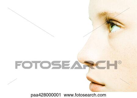 Stock Image - Teenage girl's face, extreme close-up, profile. Fotosearch