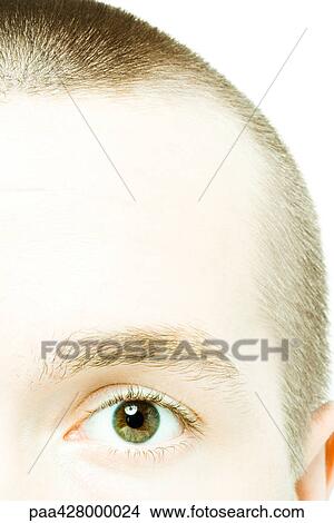 Young man looking at camera, cropped view of face, extreme close-up View Large Photo Image Picture - Young man looking at camera, cropped view of face, extreme close-up. Fotosearch