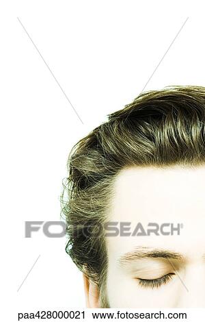 Young man with eyes closed, cropped view of head View Large Photo Image Stock Image - Young man with eyes closed, cropped view of head. Fotosearch