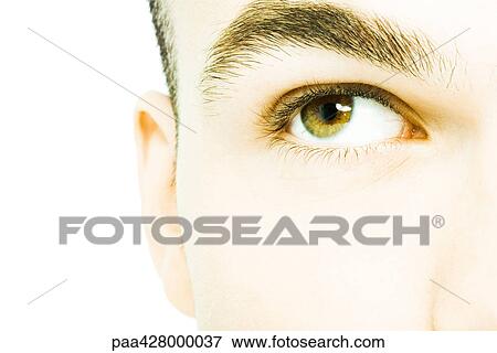 Stock Photo - Young man's eye, extreme close-up. Fotosearch