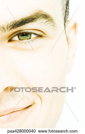 Young man's face, extreme close-up, cropped front view View Large Photo Image Stock Image - Young man's face, extreme close-up, cropped front view. Fotosearch