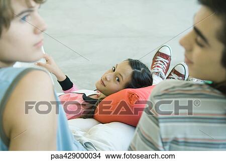 Teenage friends hanging out together View Large Photo Image Picture - Teenage friends hanging out together. Fotosearch