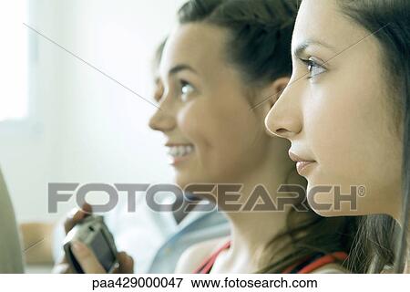 Stock Photo - Teenage friends, profile, portrait . Fotosearch