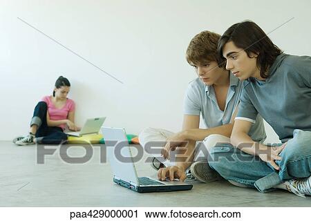 Teenagers using laptops View Large Photo Image Stock Image - Teenagers using laptops. Fotosearch