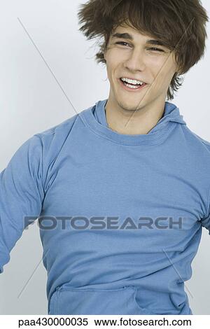 Teenage boy jumping, smiling View Large Photo Image Stock Photography - Teenage boy jumping, smiling. Fotosearch