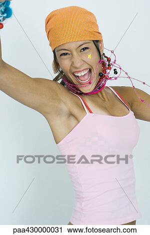 Stock Image - Teenage girl cheering, portrait. Fotosearch