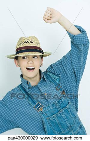 Stock Photo - Teenage girl cheering, portrait. Fotosearch