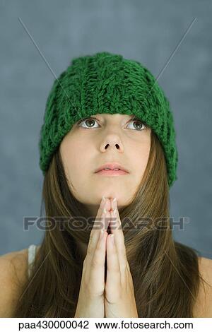 Teenage girl praying, portrait View Large Photo Image Stock Image - Teenage girl praying, portrait. Fotosearch