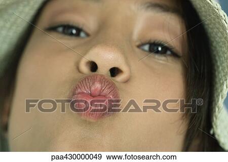 Teenage girl puckering lips at camera, close-up View Large Photo Image Stock Photo - Teenage girl puckering lips at camera, close-up. Fotosearch