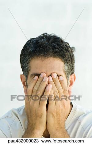 Man covering face with hands, head and shoulders, portrait View Large Photo Image Stock Image - Man covering face with hands, head and shoulders, portrait. Fotosearch