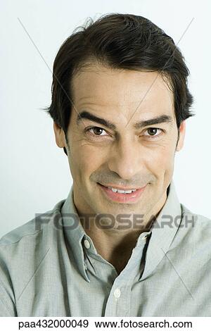 Man looking at camera, raising eyebrow, head and shoulders, portrait View Large Photo Image Stock Photo - Man looking at camera, raising eyebrow, head and shoulders, portrait. Fotosearch