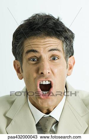 Man screaming, looking at camera, head and shoulders, portrait View Large Photo Image Stock Image - Man screaming, looking at camera, head and shoulders, portrait. Fotosearch