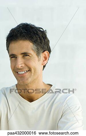 Man smiling, head and shoulders, portrait View Large Photo Image Stock Photograph - Man smiling, head and shoulders, portrait. Fotosearch