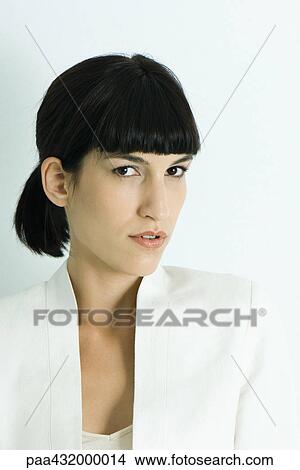 Picture - Woman, giving camera sideways glance, head and shoulders, portrait. Fotosearch
